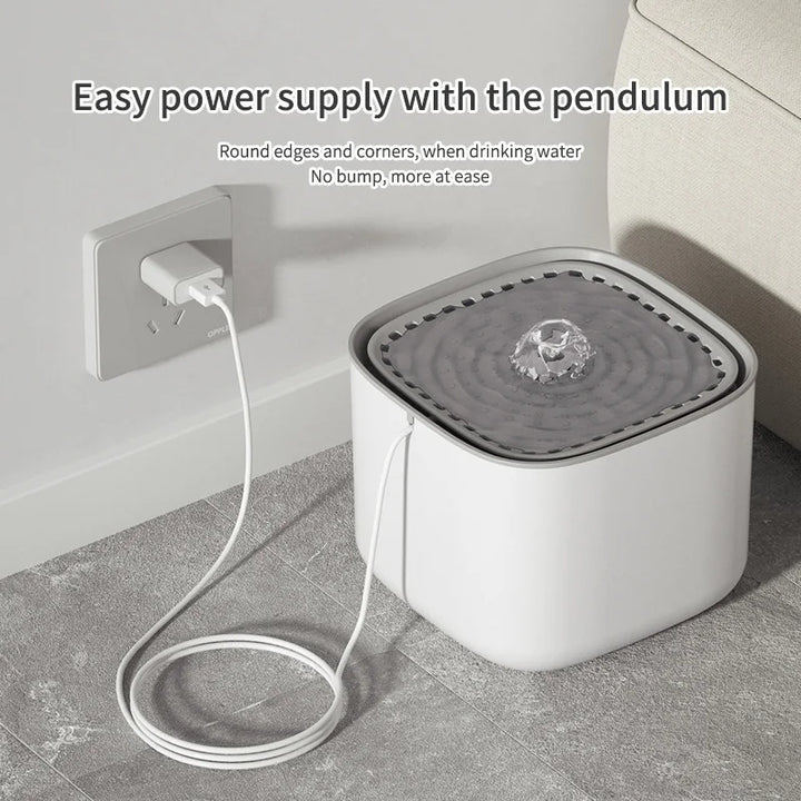 Cat Water Fountain water fountain with a power cord connected to a wall outlet