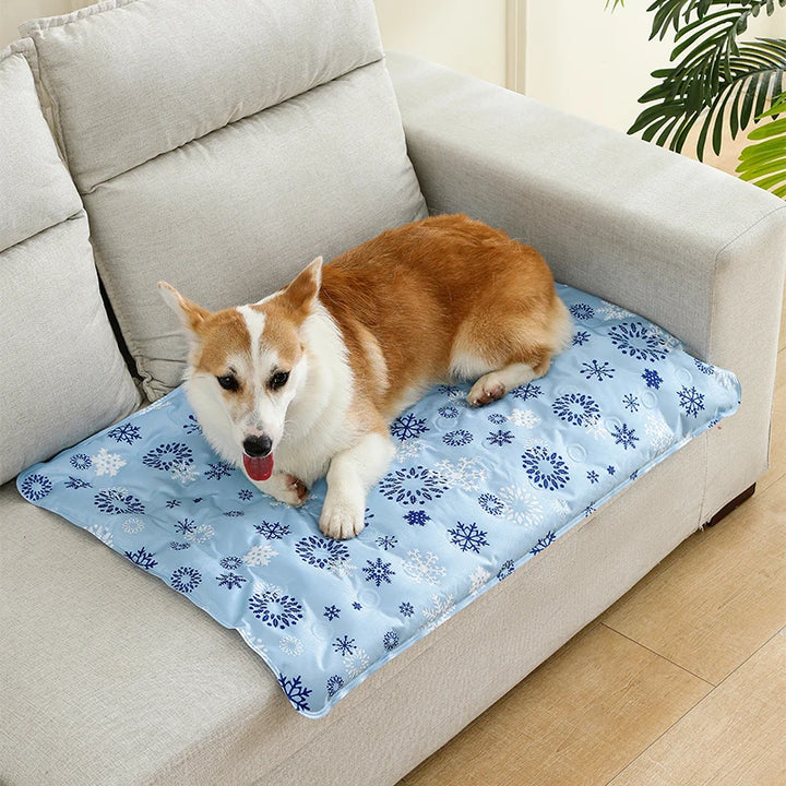 Dog resting on a floral-patterned pet cooling mat
