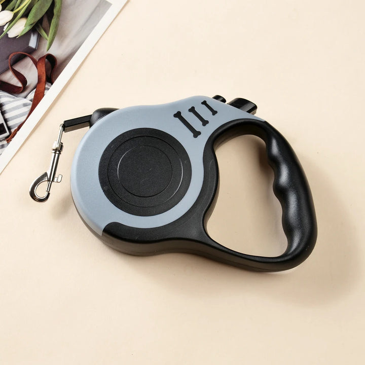 Retractable dog leash with gray handle and black handle